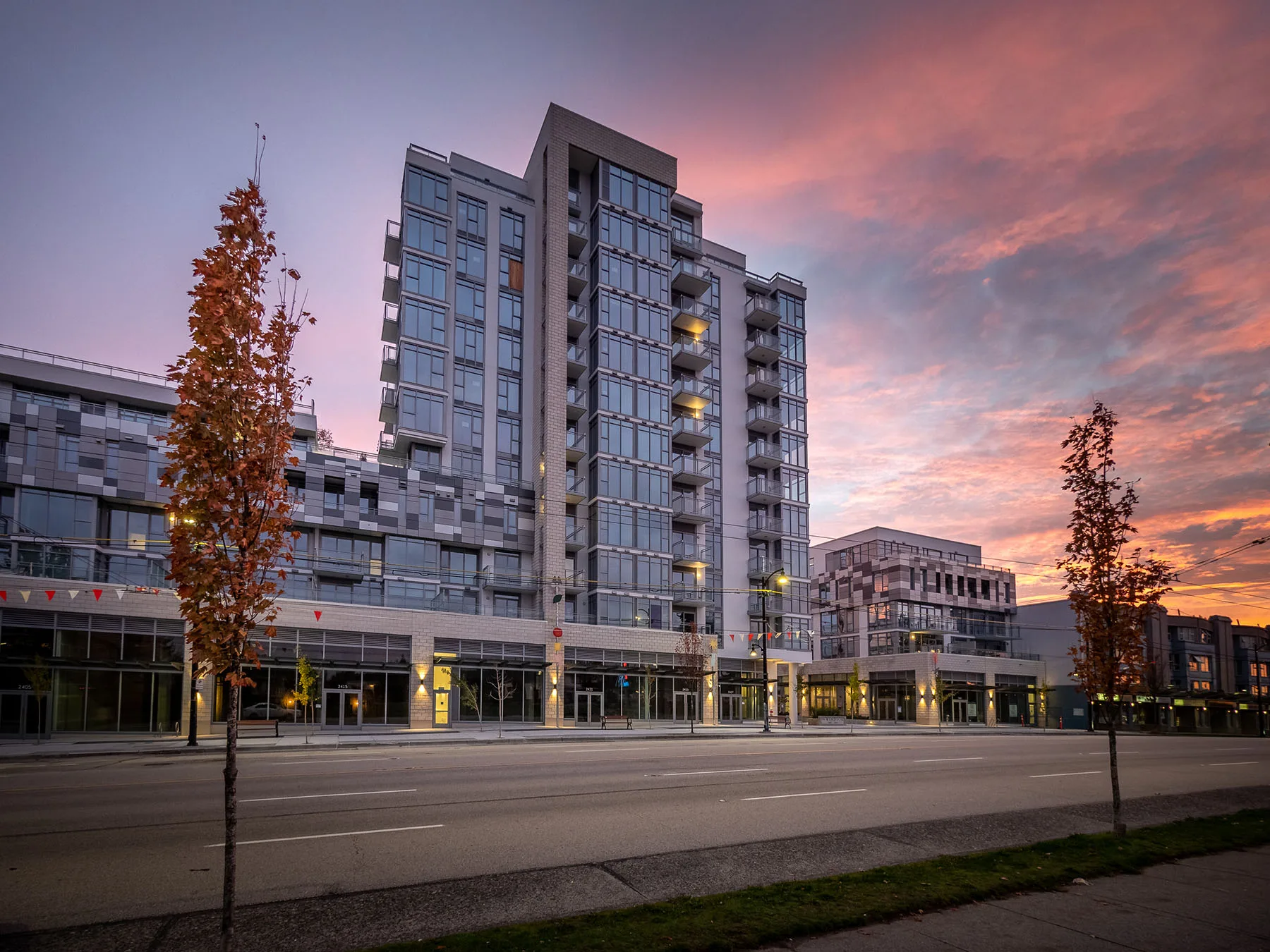 The completed Windsor tower and neighbourhood retail on Kingsway at sunset